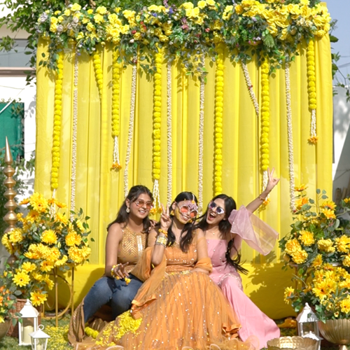 haldi decoration with marigolld flowers and urli